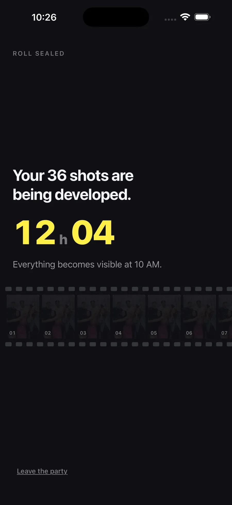 The Film 36 developing screen on night black, announcing 36 shots being developed with a twelve hour countdown and a contact strip of latent frames